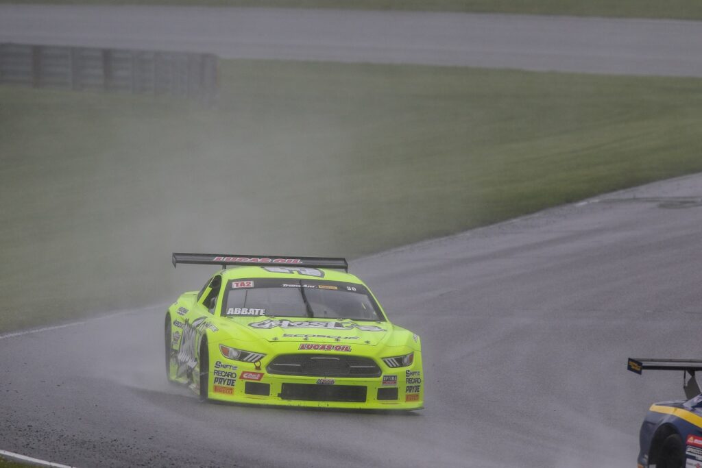 Abbate racing in the rain at Lime Rock