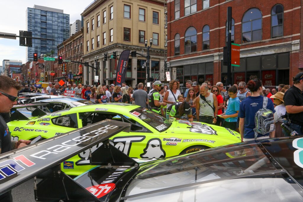 Fans gather around on broadway street for the MCGP